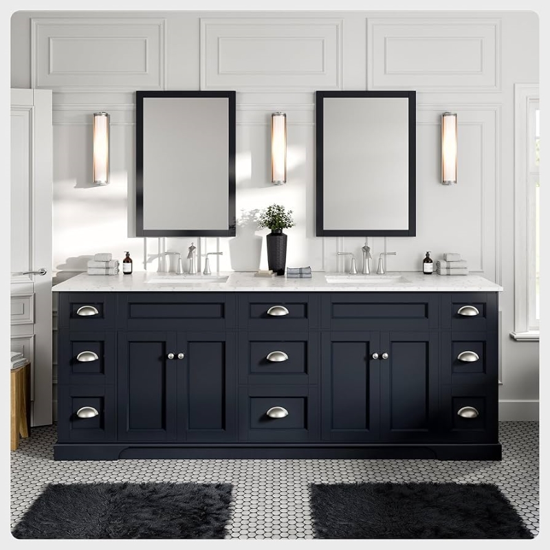 Double sink bathroom vanity in navy, paired with two mirrors.