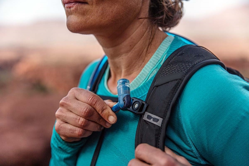 woman carrying hydration pack