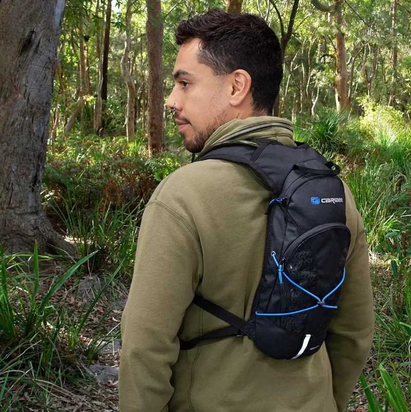 man carrying caribee hydration pack